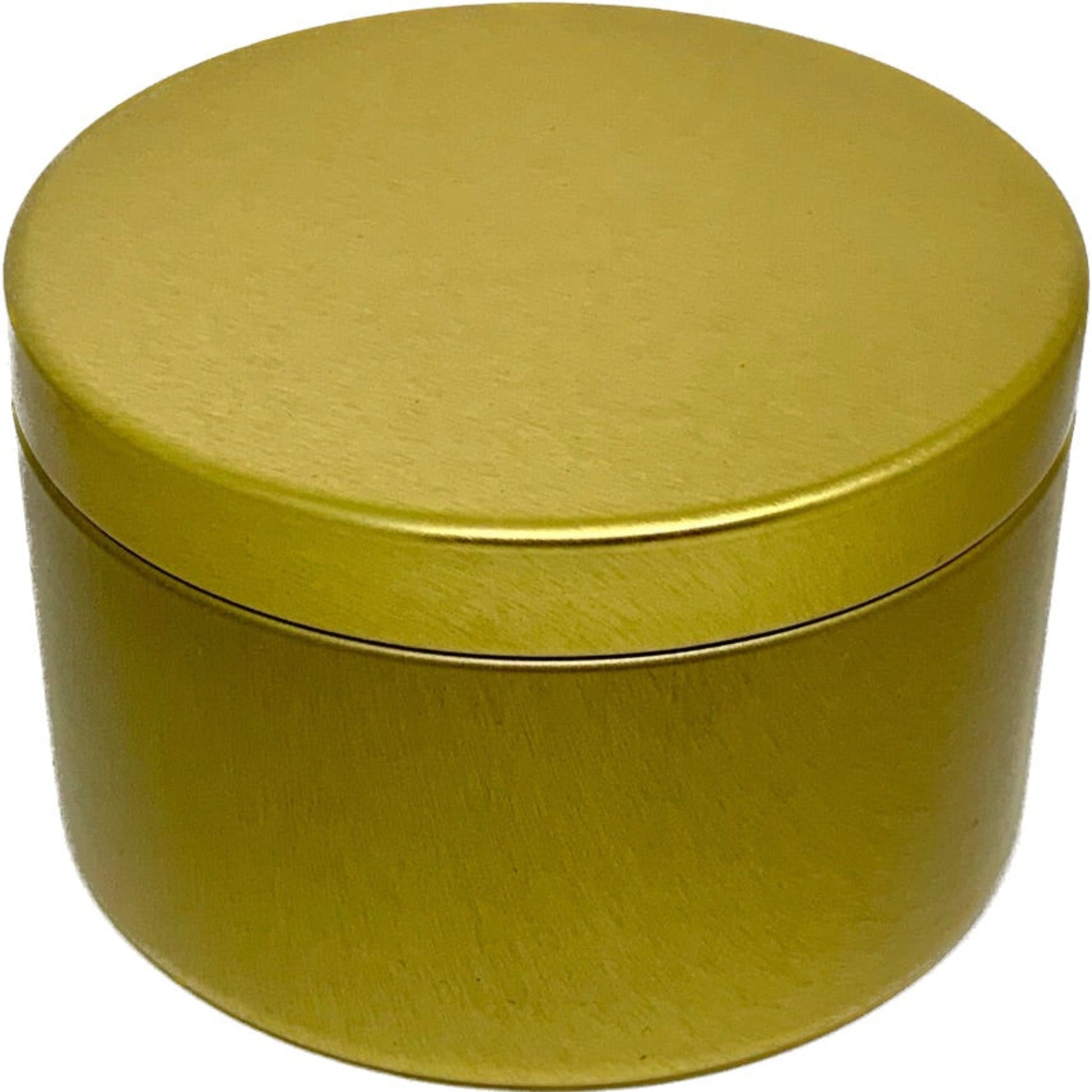 candle in gold tin